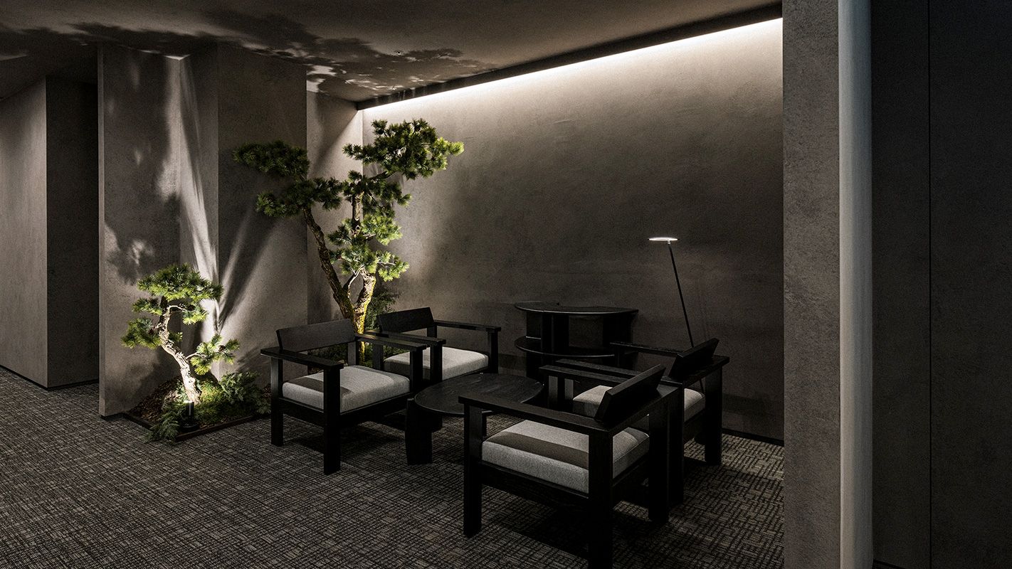 Quiet waiting corner with armchairs and pine bonsai