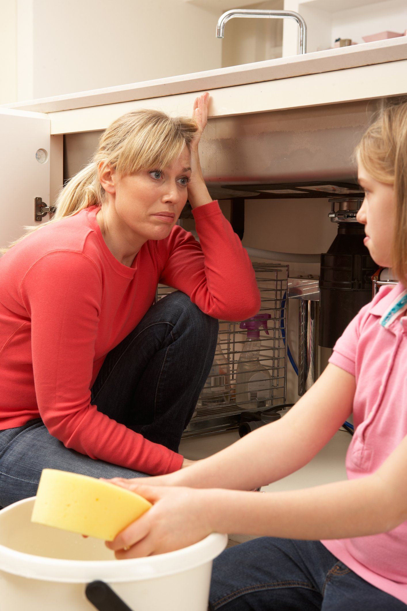 Mother And Daughter Under The Sink — Parkland, FL — Water Damage Solutions Mother And Daughter Under The Sink — Parkland, FL — Water Damage Solutions