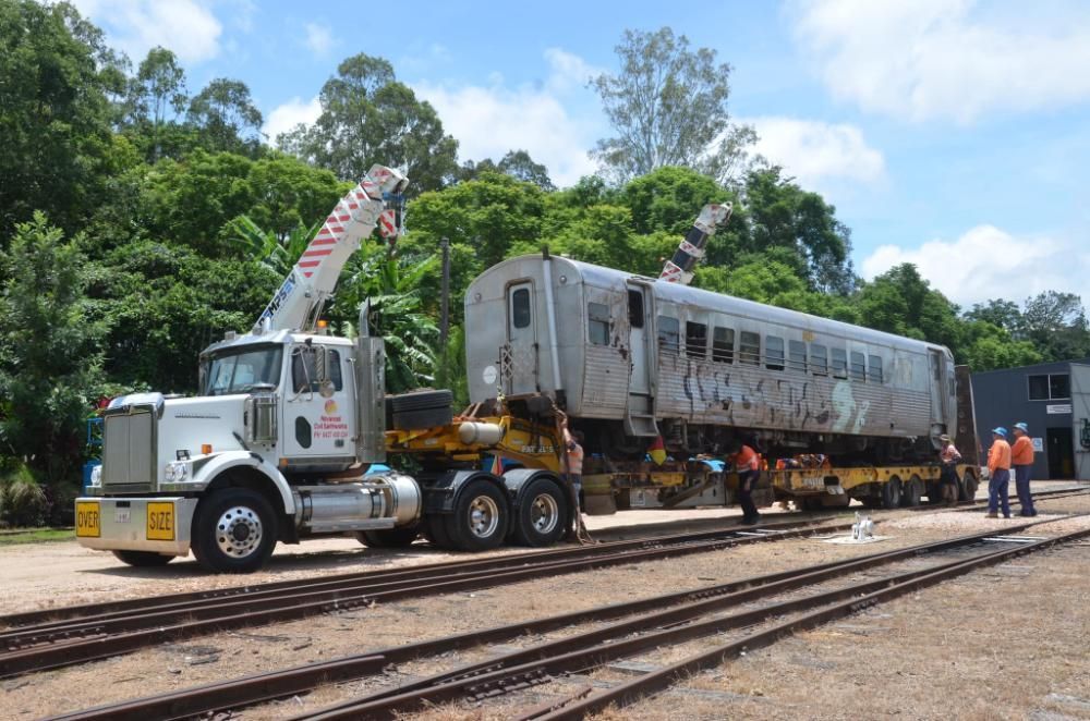 A Truck is Carrying a Train Car on a Trailer — Advanced Civil Earthworks In Cairns, QLD