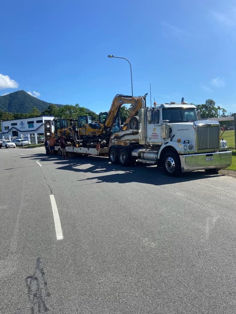 A White Semi Truck is Parked on the Side of the Road — Advanced Civil Earthworks In Cairns, QLD