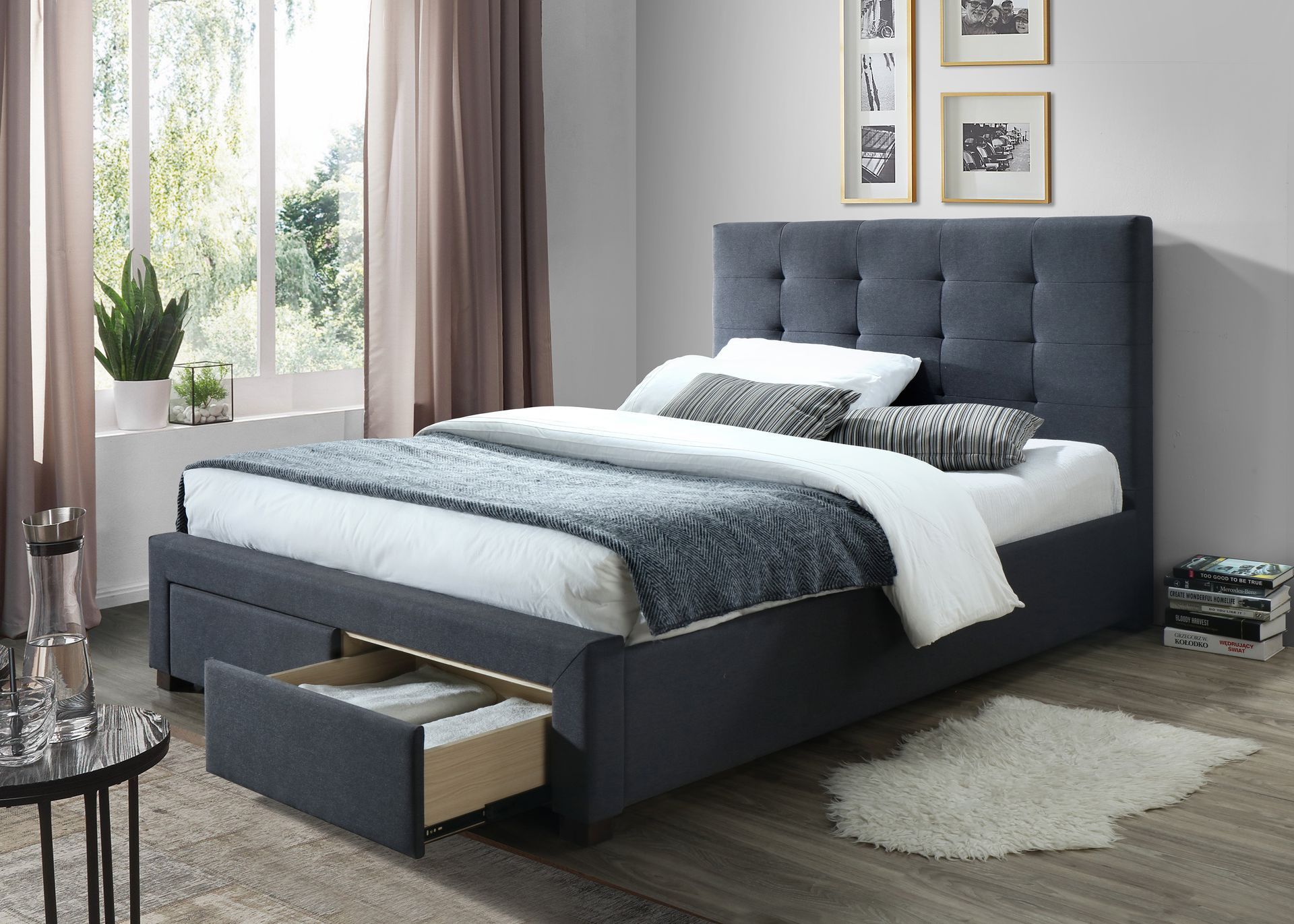 a bed with a drawer underneath it in a bedroom - upholstered bed frame