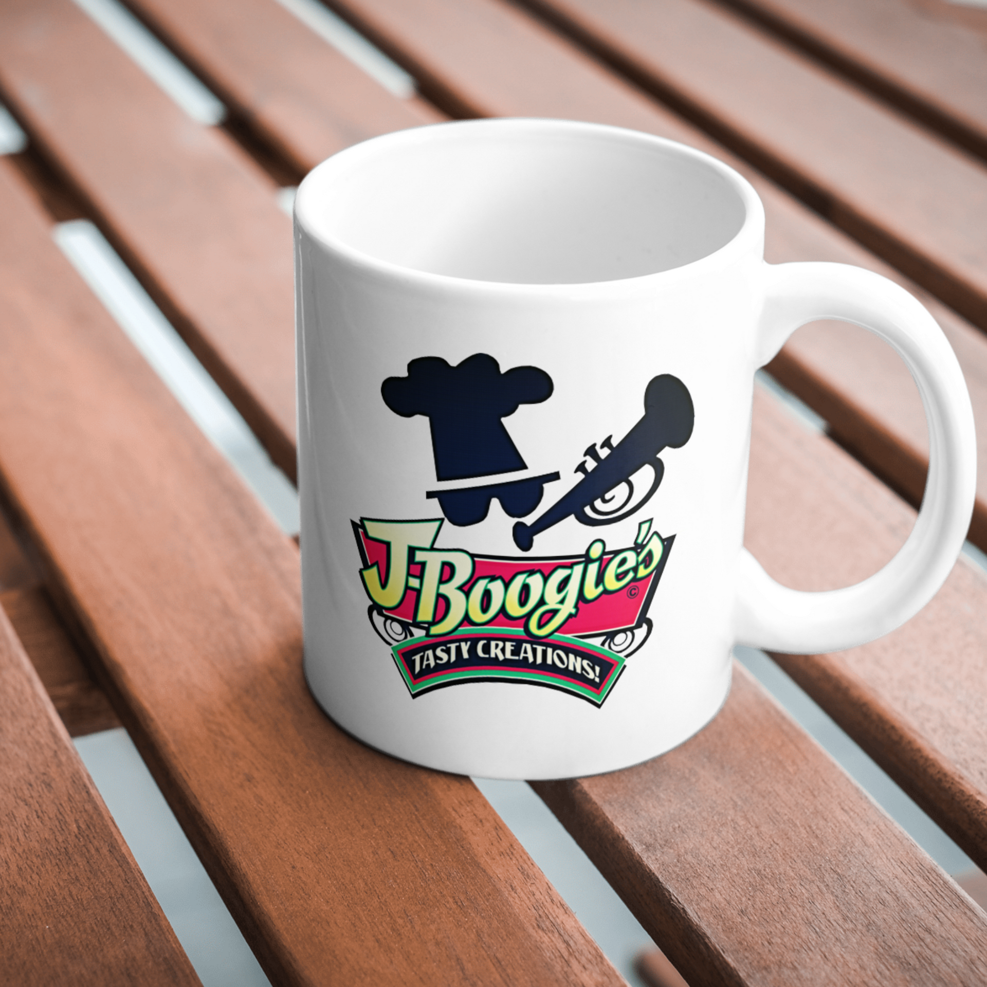 J-Boogie’s Tasty Creations branded merchandise, including hats and t-shirts, available for BBQ enthusiasts.