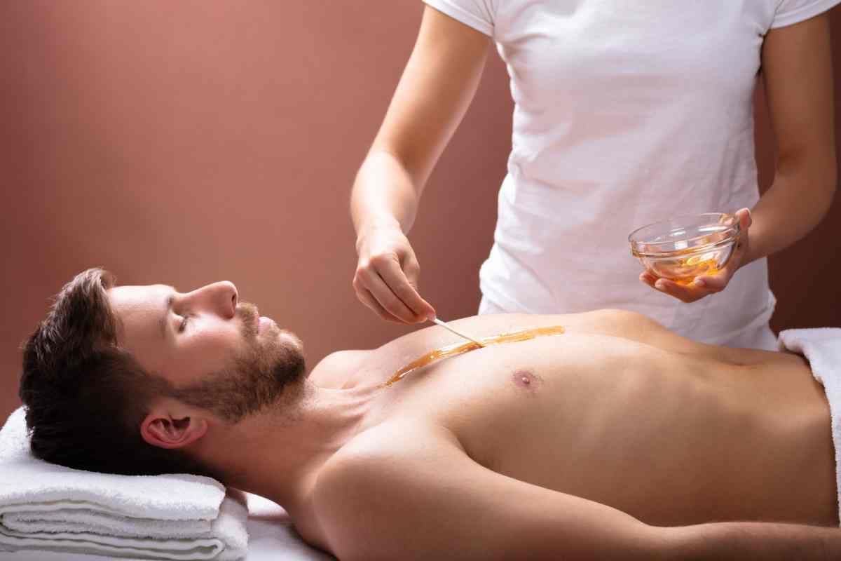 A customer receiving body waxing for men near Lexington, Kentucky (KY)