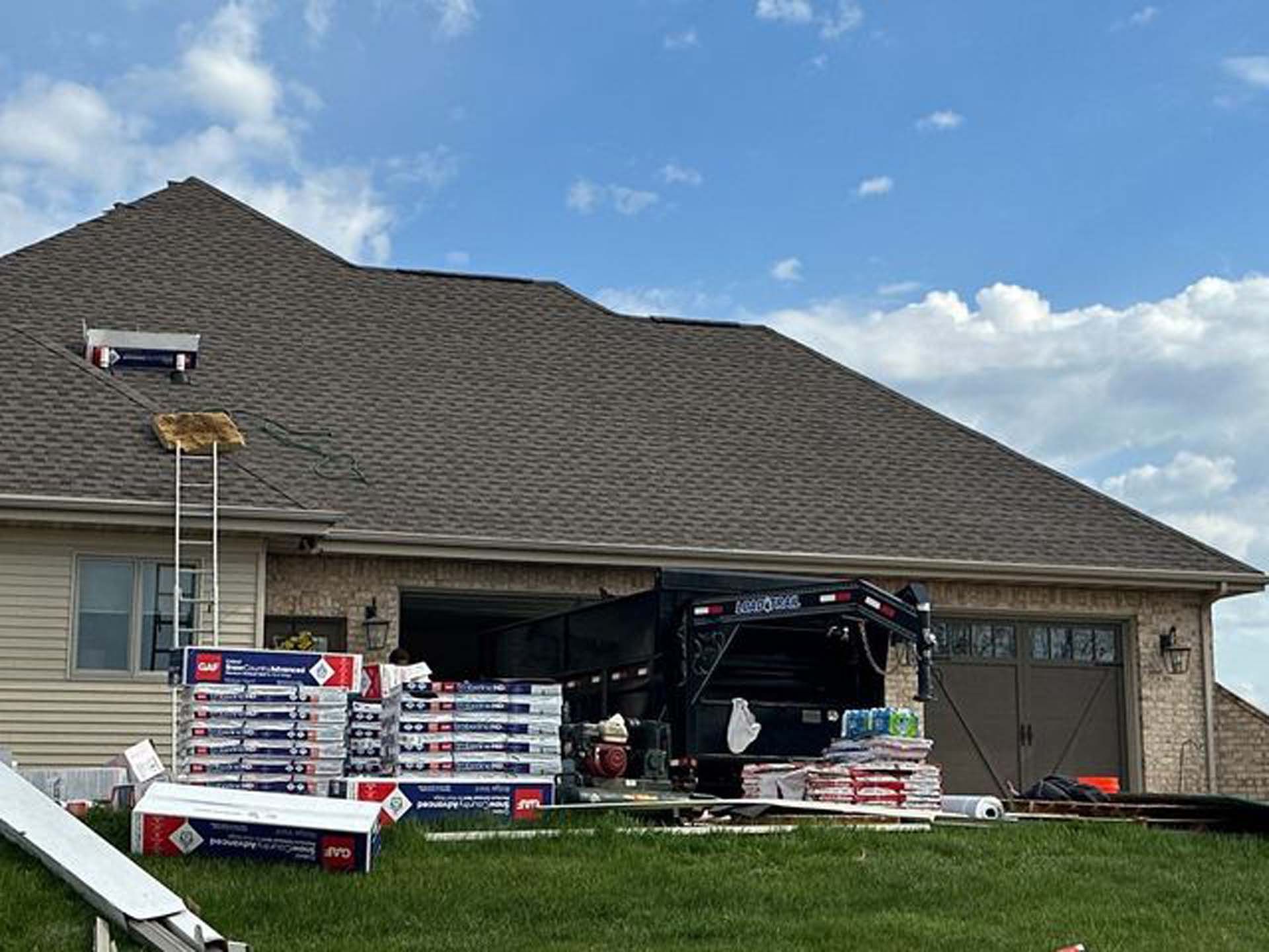 A house with a truck parked in front of it.