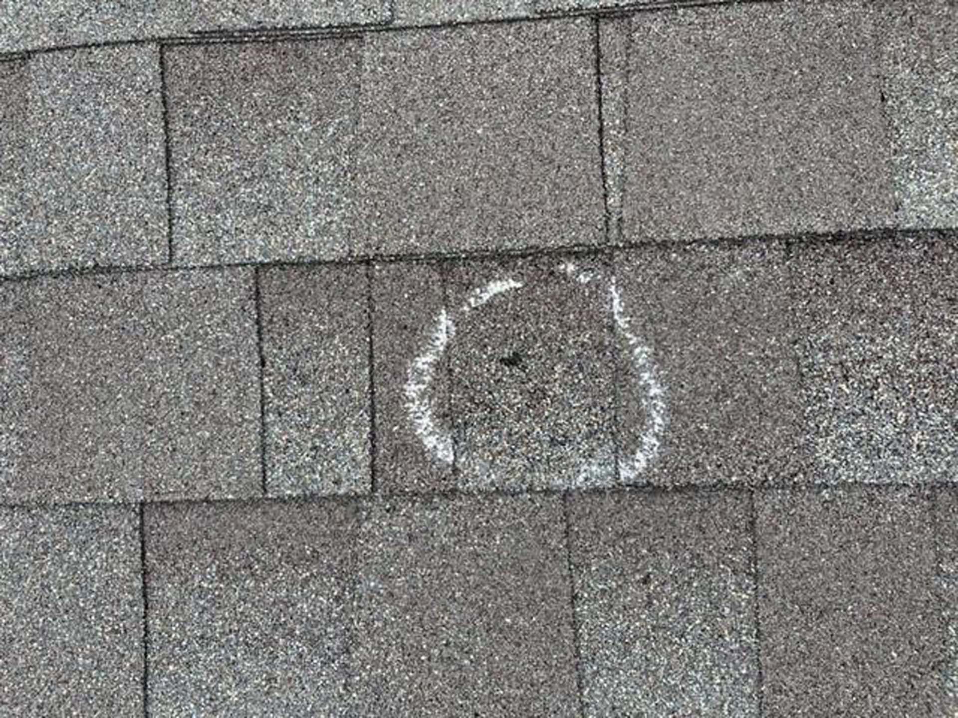 A close up of a roof with a hole in it.