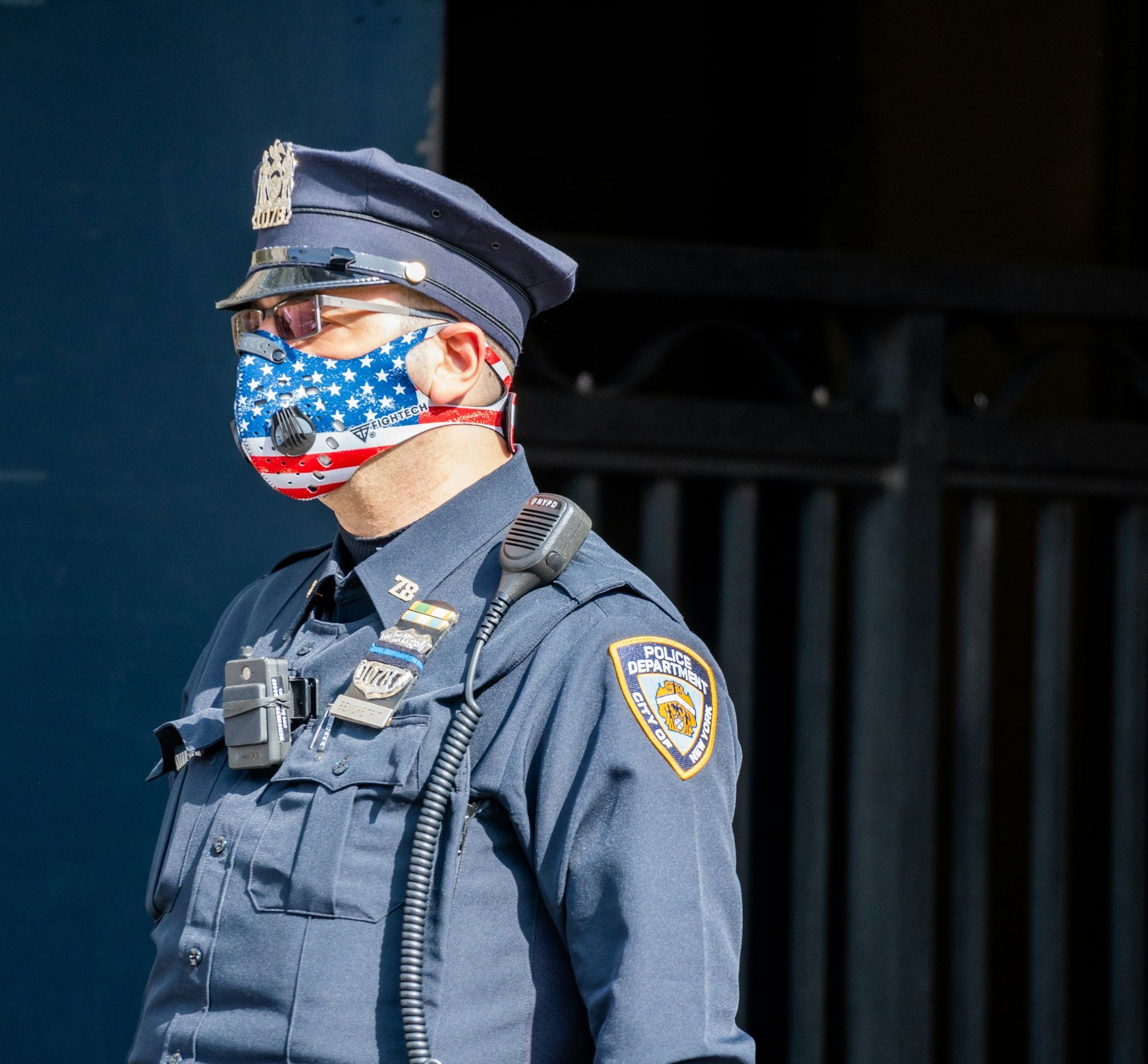A police officer wearing an American flag face mask