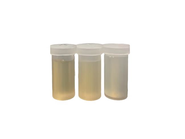 Three test tubes filled with different colored liquids on a white background.
