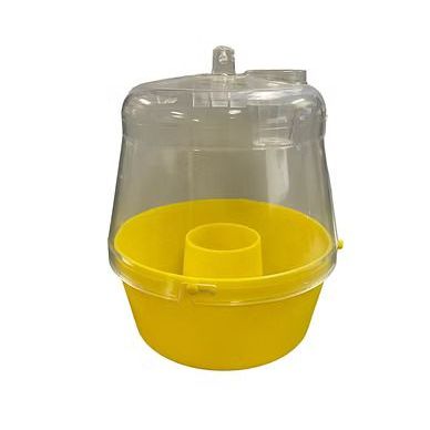 A yellow fly trap with a clear lid on a white background.