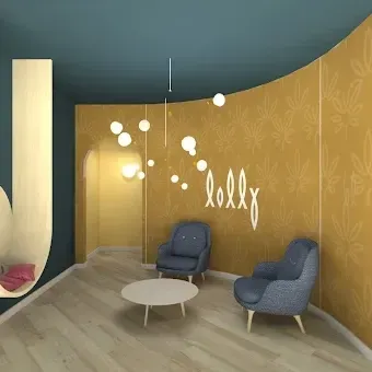 A modern, curved room features blue walls, gold floral wallpaper, two blue armchairs, a coffee table, and pendant lights.
