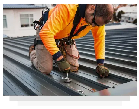 a technician screwing a bolt onto the roof