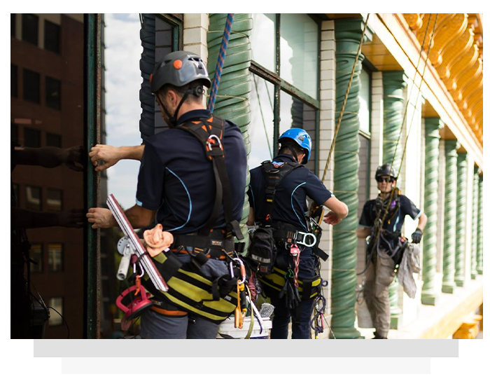 A group of men are working on a building.