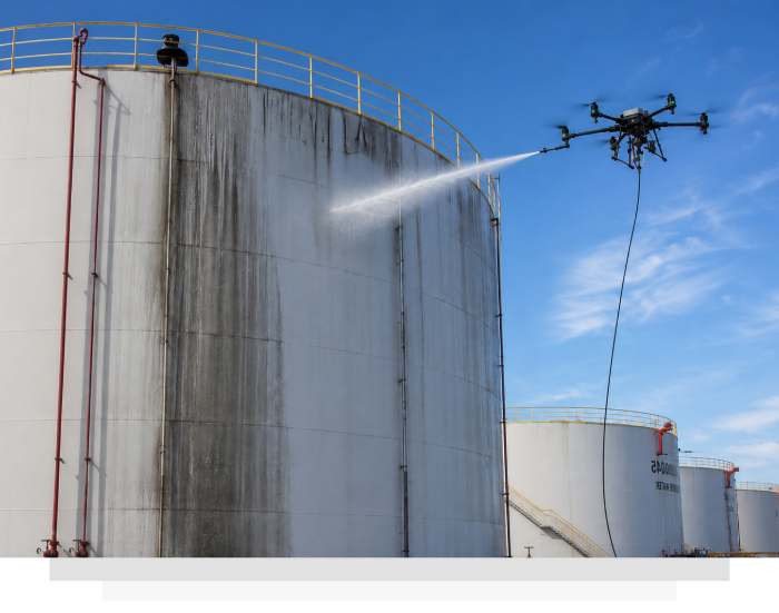 a drone in the act of cleaning a water tank