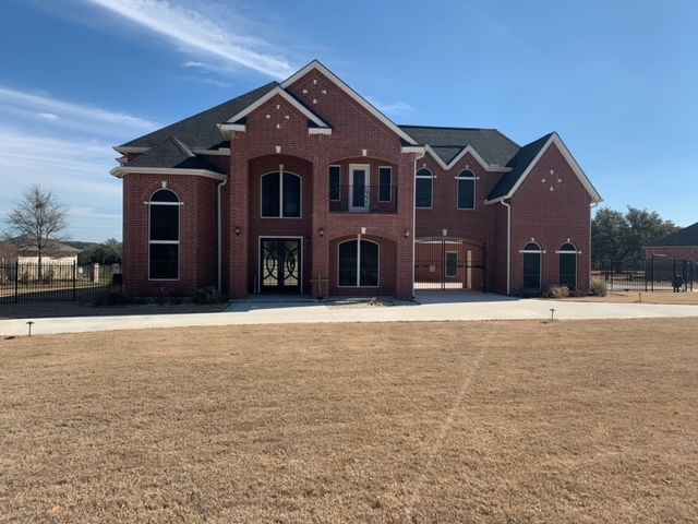 A large brick house with a lot of windows