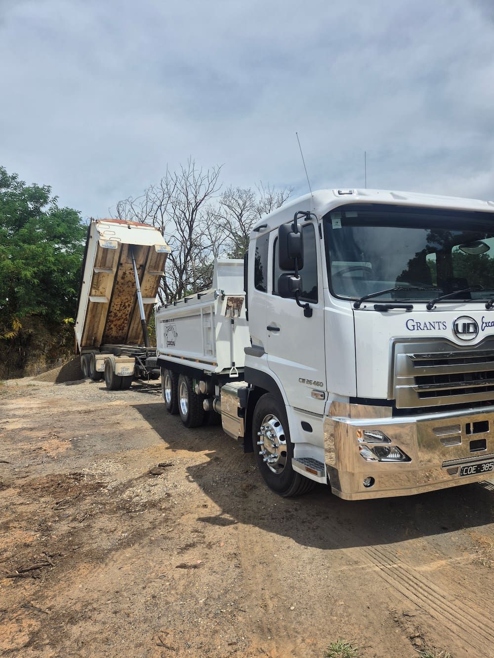 A Large White Truck Is Parked On Dirt — Grants Excavations In Osbornes Flat, VIC