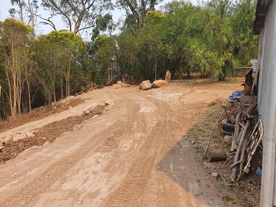 A Dirt Road Going Through A Forest With Trees On Both Sides — Grants Excavations In Osbornes Flat, VIC