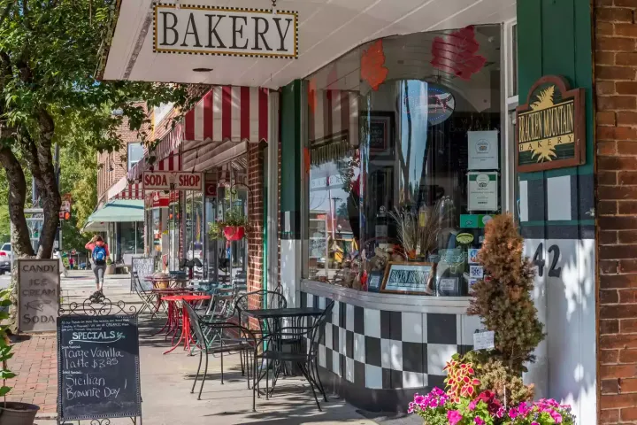 a bakery is located on the side of a city street .