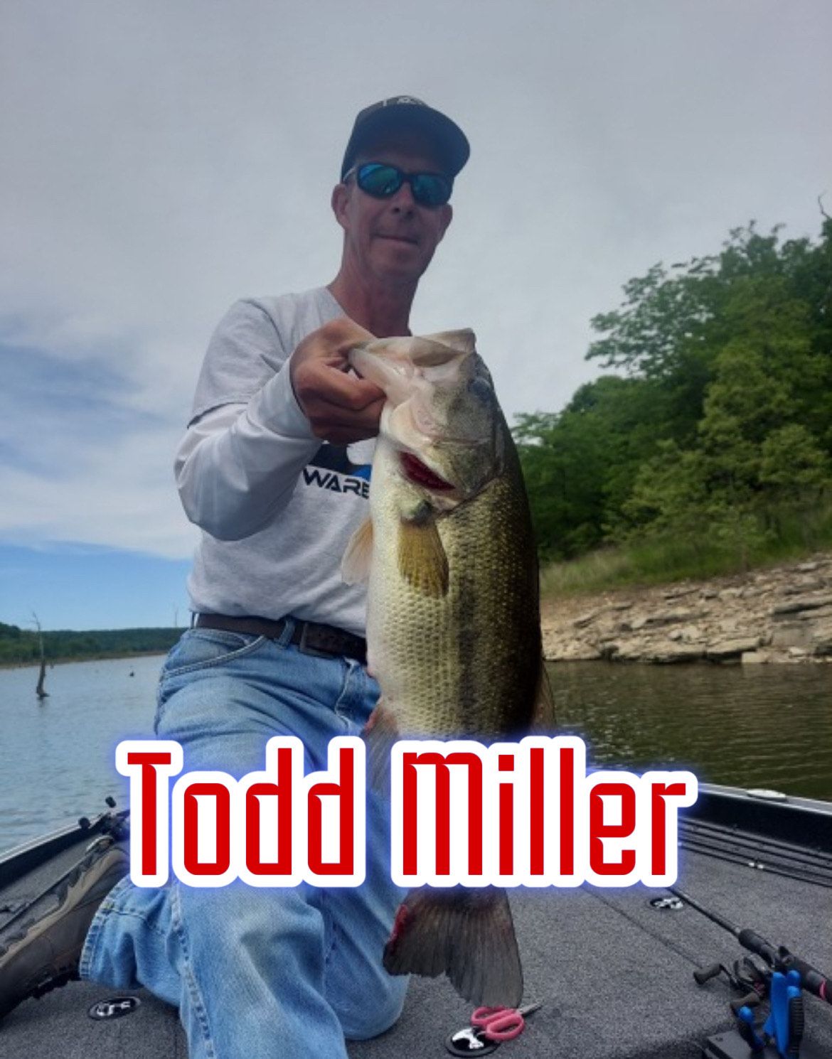 Man on a fishing boat holding a large bass, with “Todd Miller” text overlaid.