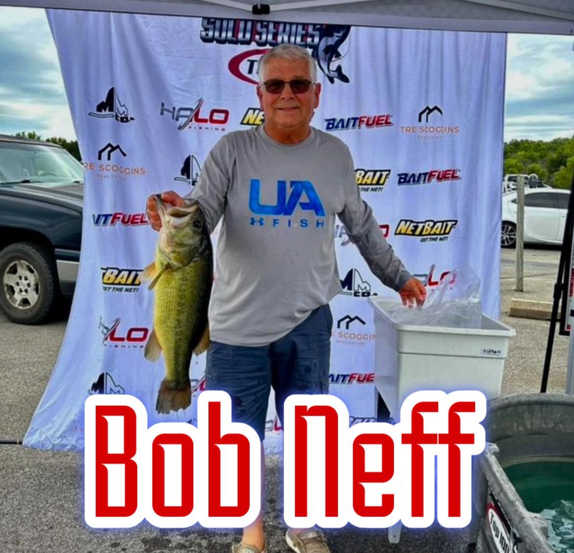Angler holding a large fish at a tournament booth, with “Bob Neff” text overlaid.