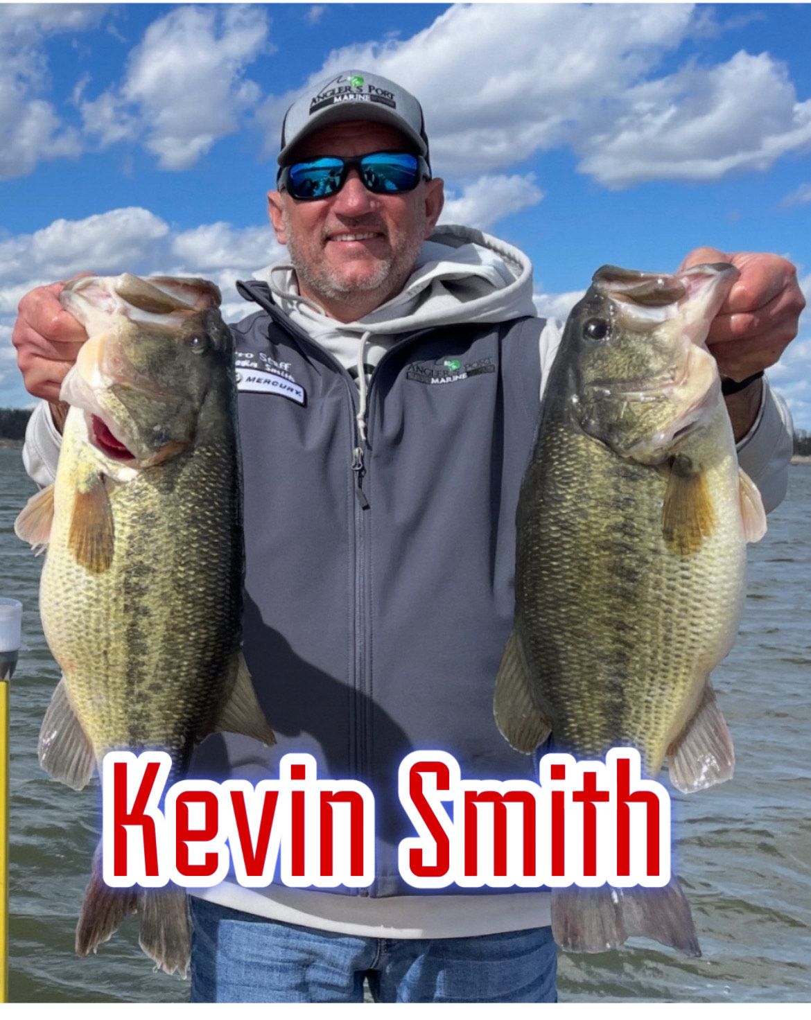 Man holding two large bass fish by a lake, with the name “Kevin Smith” overlaid.