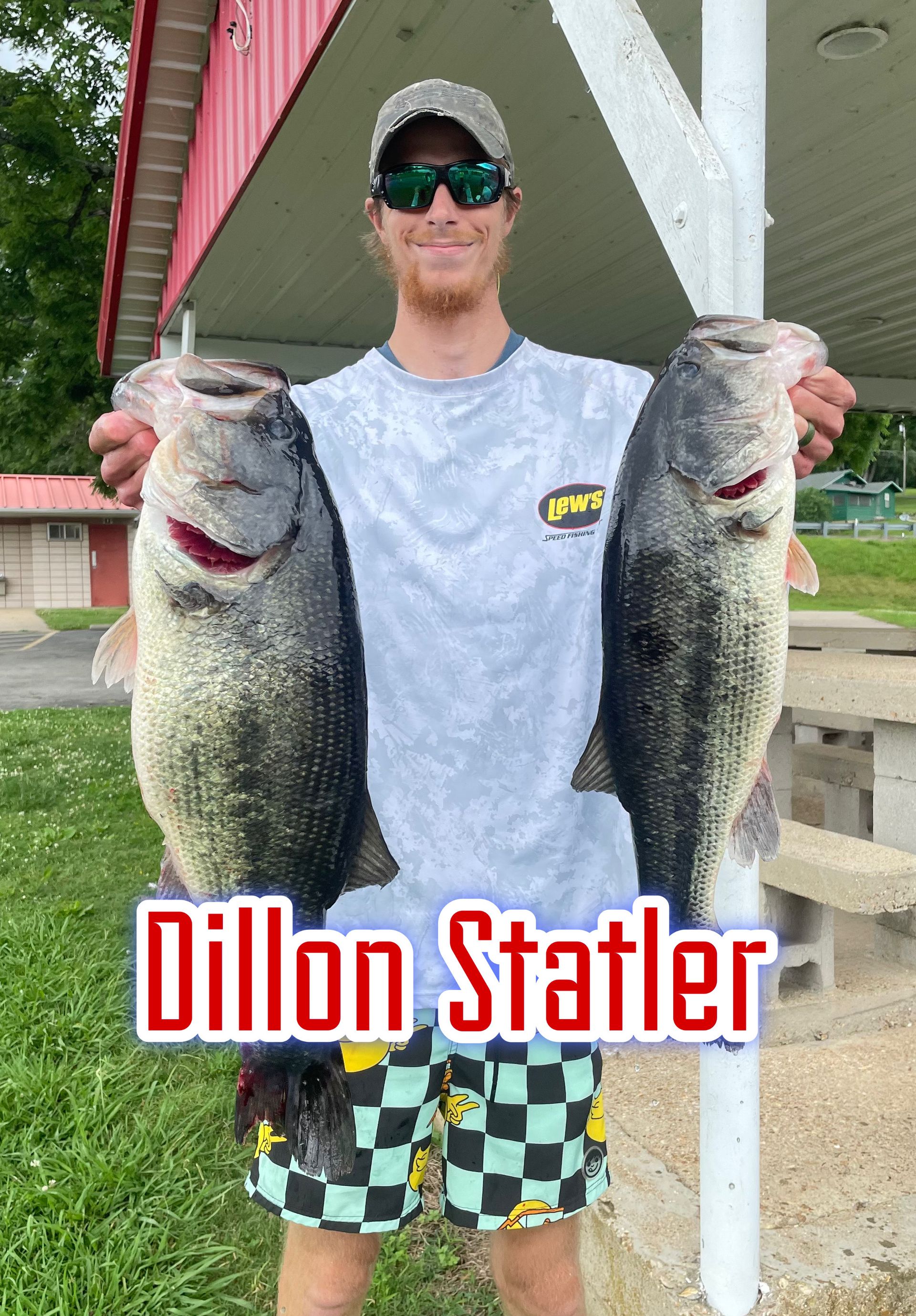 Man holding two large fish in front of a lakeside dock, with “Dillon Statler” text overlay.
