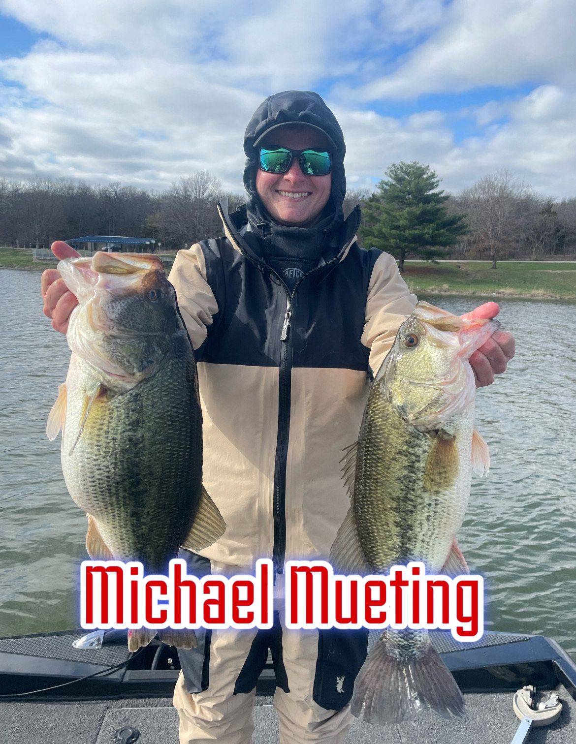 Person on a boat holding two large fish on a lake, with “Michael Mueting” text overlaid.