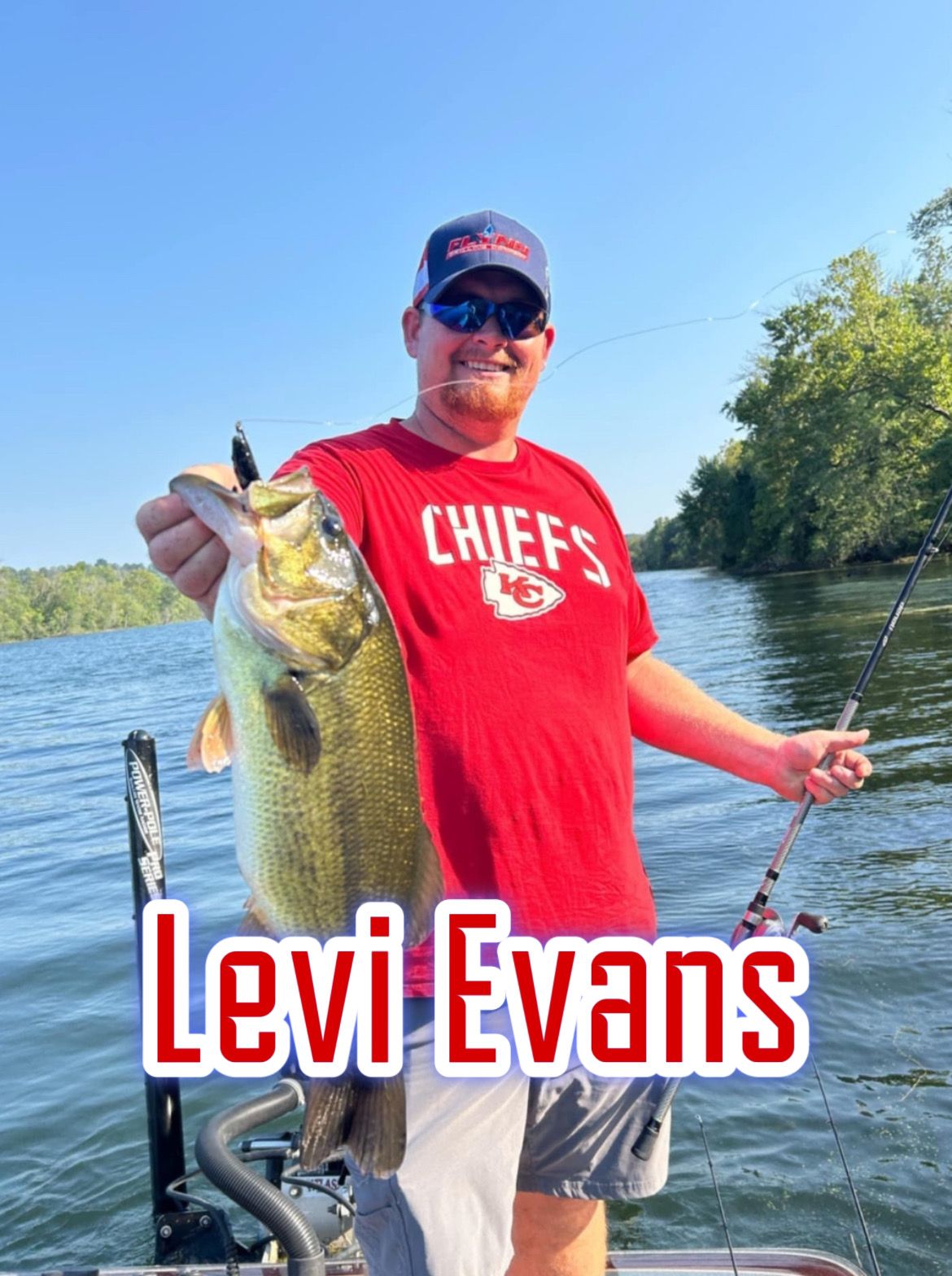 Man holding a large fish on a boat, wearing a red Chiefs shirt, with “Levi Evans” text overlay.