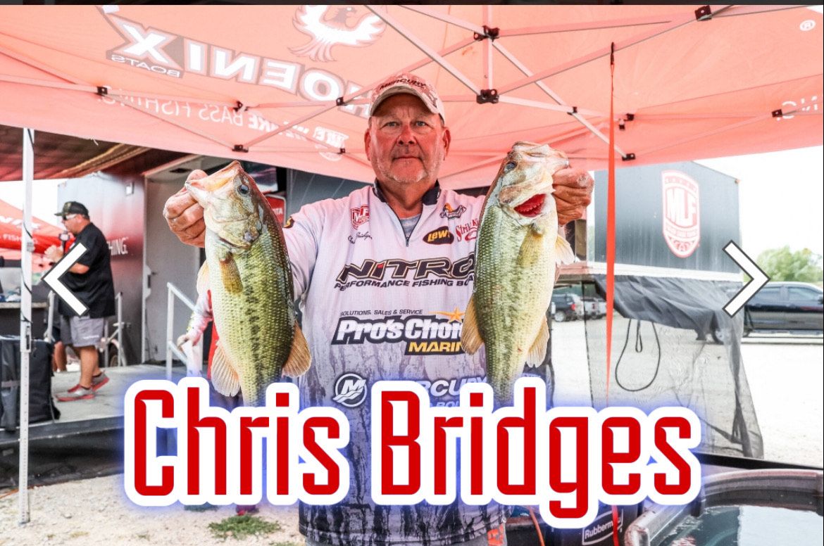 Man holding two largemouth bass under a red canopy, with name text “Chris Bridges” below.