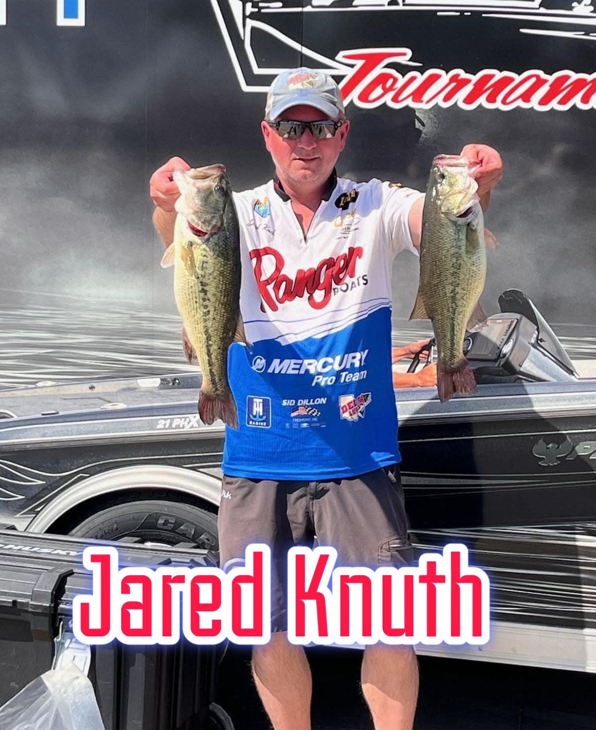 Man holding two large fish in front of a boat, with “Jared Knuth” text at the bottom.