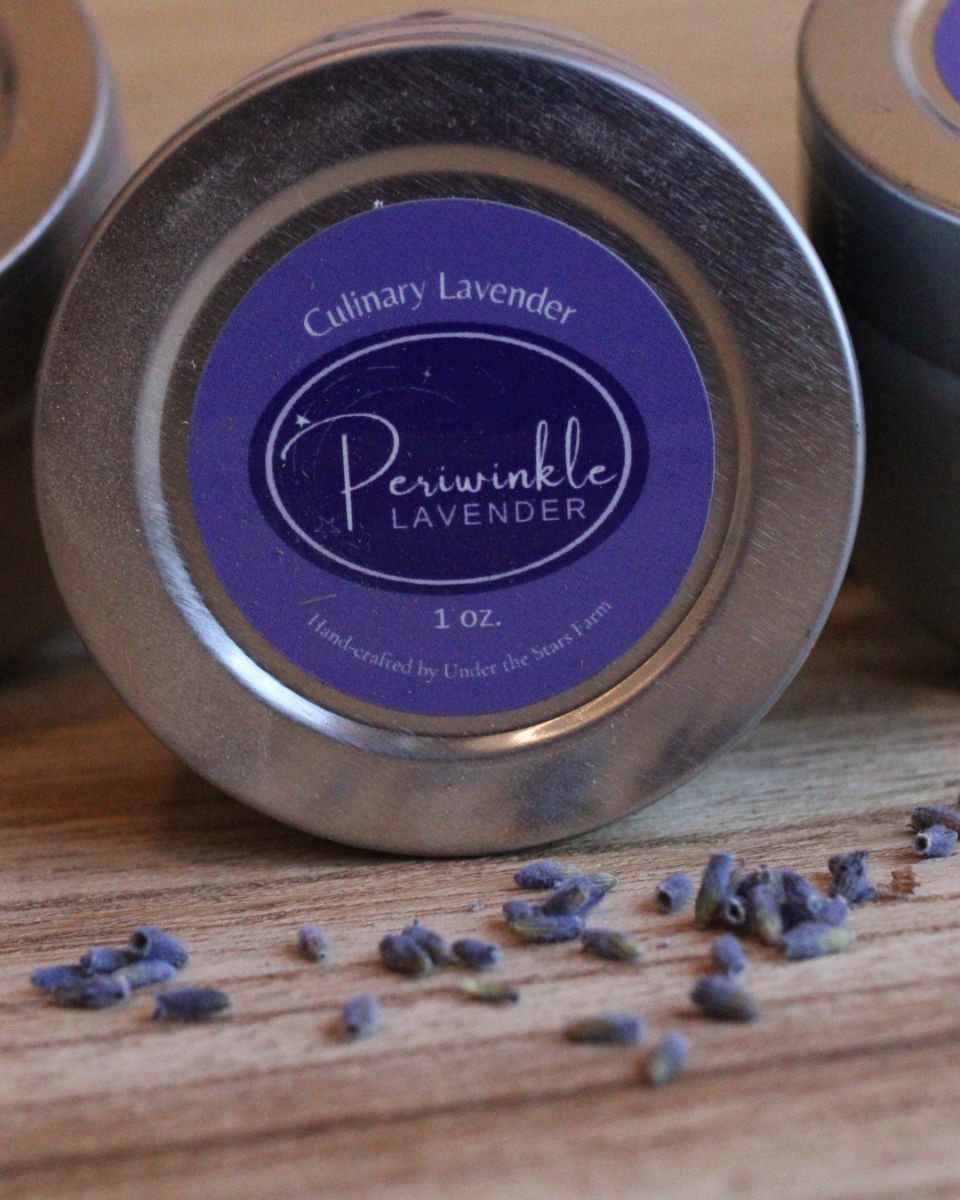A can of periwinkle lavender sits on a wooden table