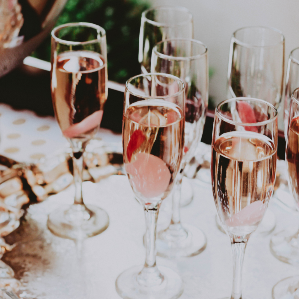 A bunch of champagne glasses are sitting on a table