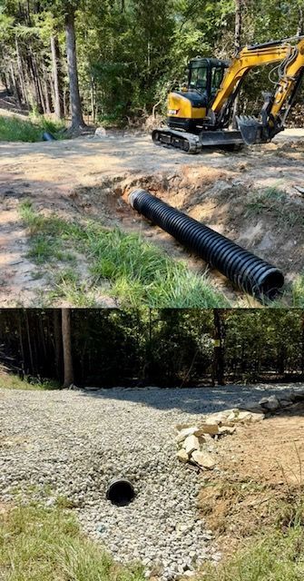 Excavator working on a gravel drainage area beside a forest, with black culvert pipes in the foreground.
