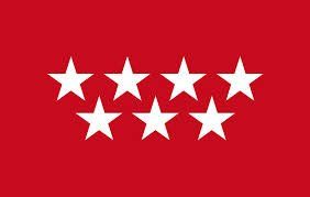 Bandera roja con siete estrellas blancas dispuestas en dos filas.