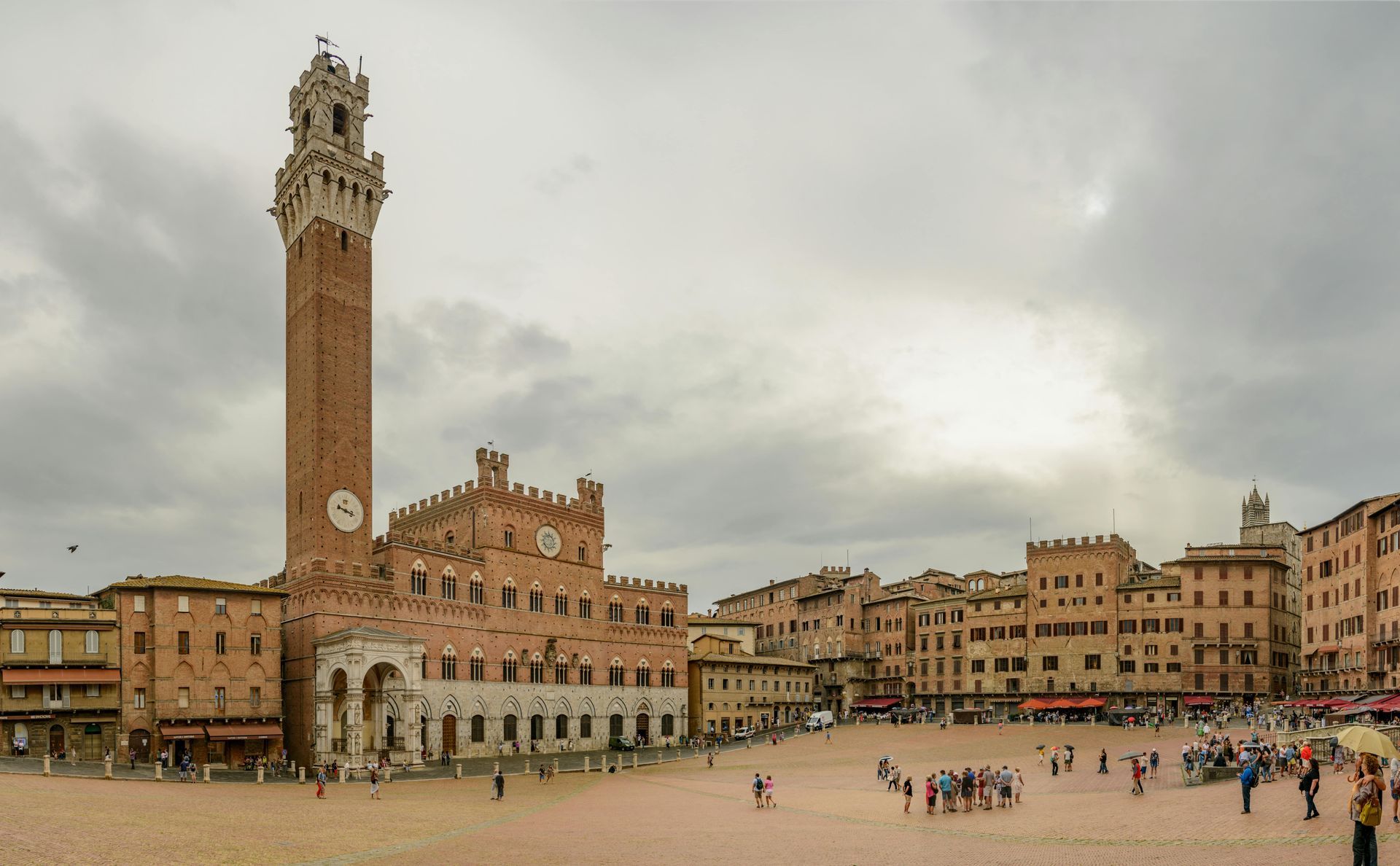 A large building with a clock tower in the middle of it