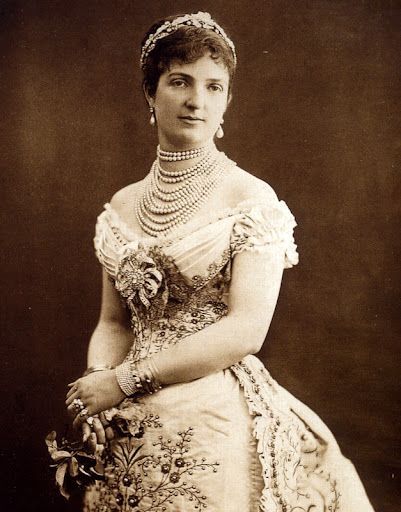 A black and white photo of a woman in a dress
