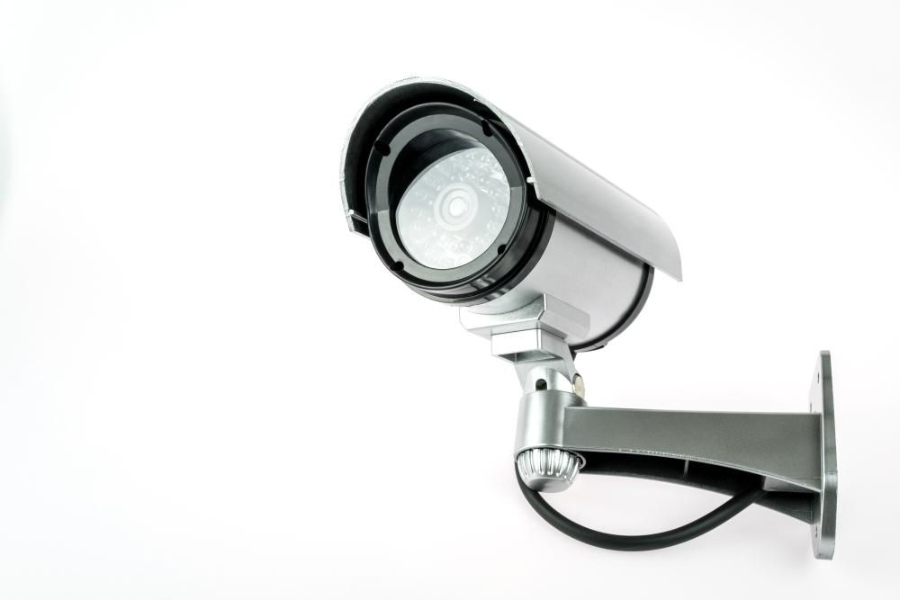 A Security Camera Is Mounted to A Wall on A White Background — Fortress Locksmiths & Security in Brunswick Heads, NSW