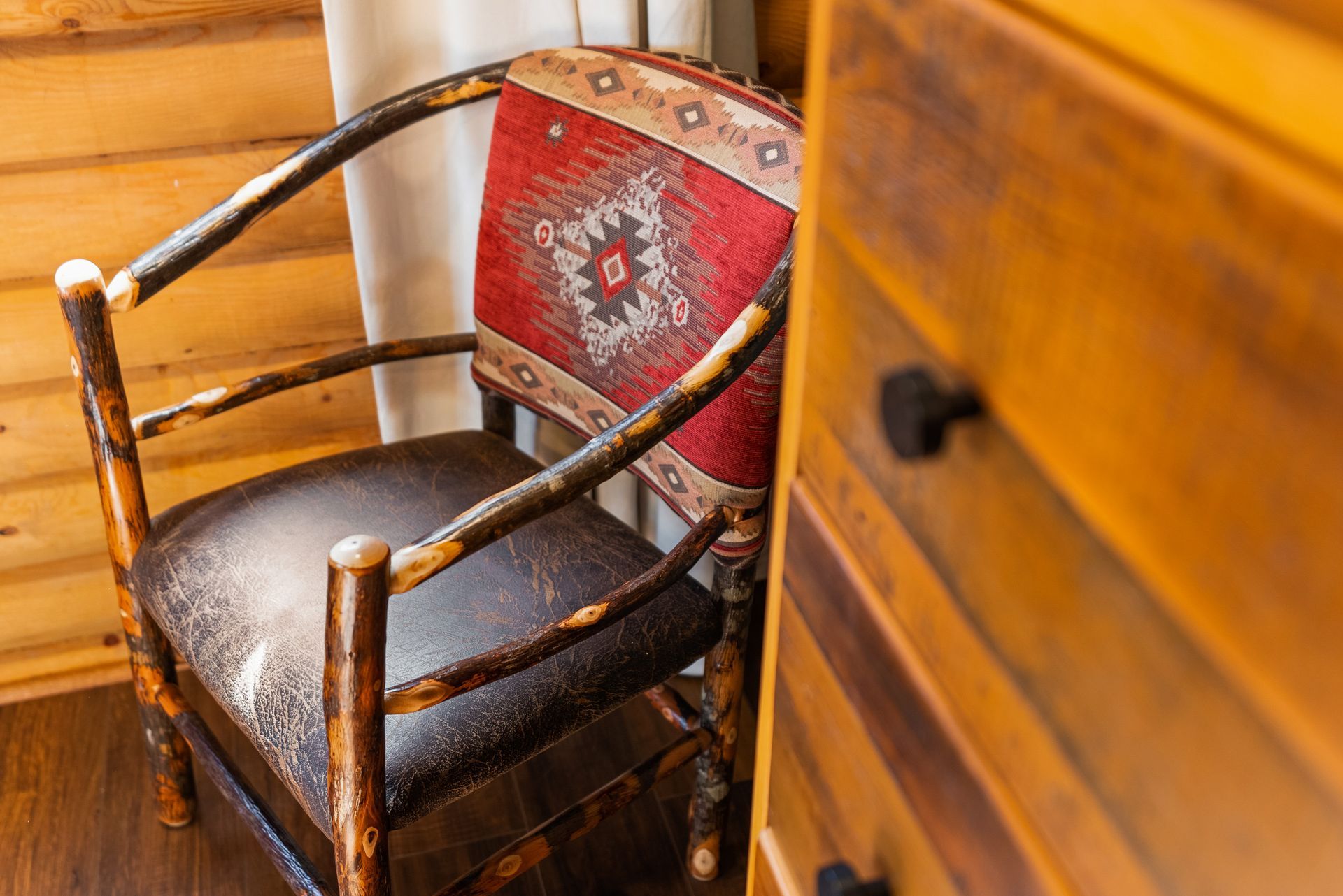 chair near wooden dresser