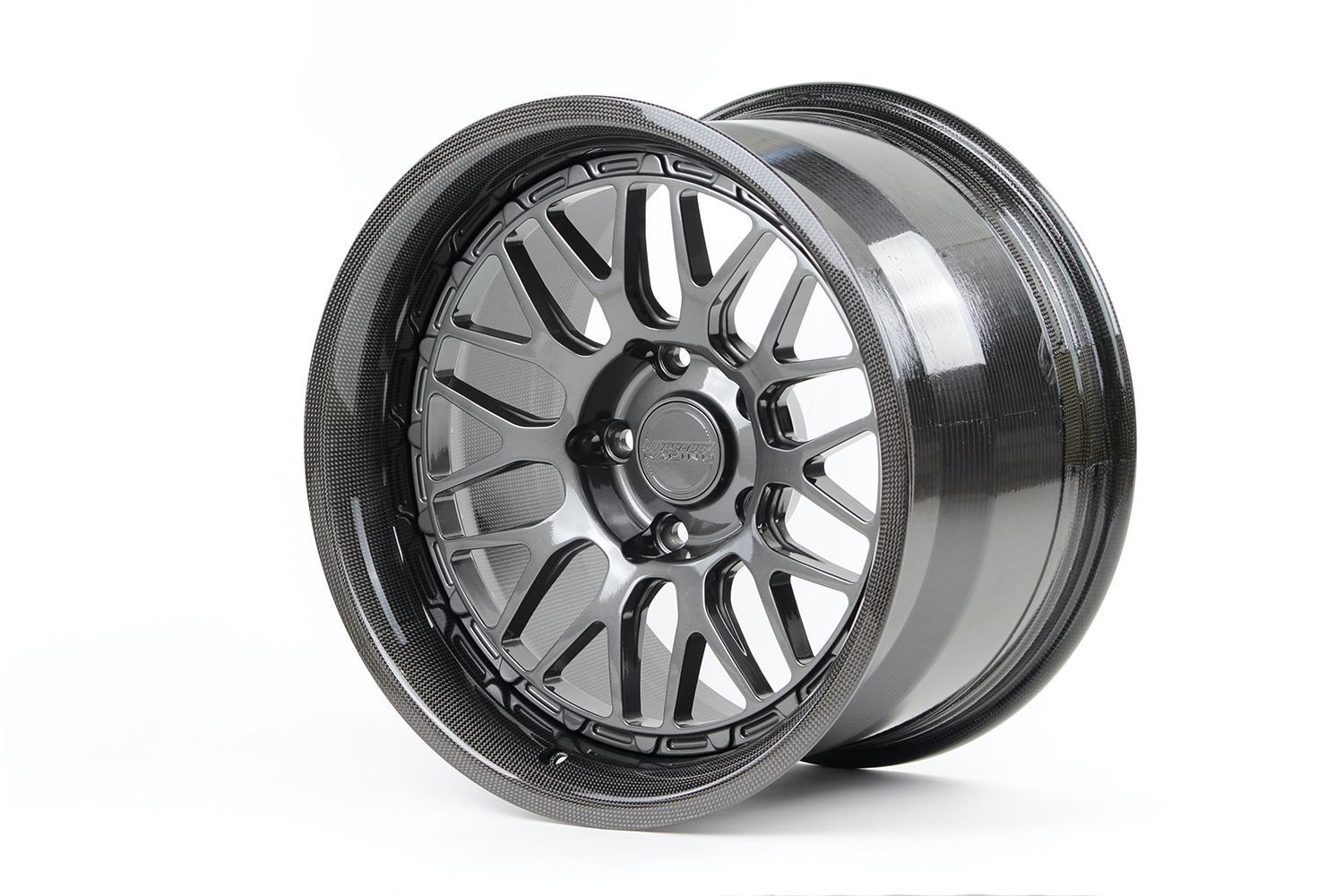 Black and gray carbon fiber car wheel with a multi-spoke design, on a white background.
