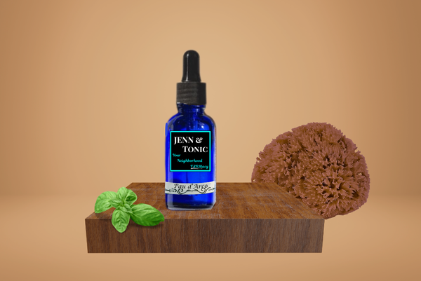 A dropper bottle of Pau D'arco tincture is sitting on a wooden cutting board next to a sponge.