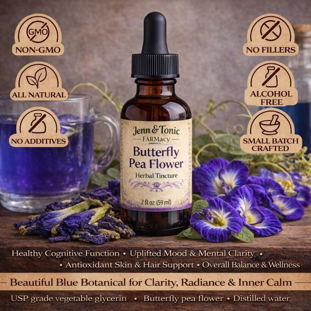 A bottle of Jenn & Tonic Butterfly Pea Flower herbal tincture surrounded by purple butterfly pea flowers and a teacup.