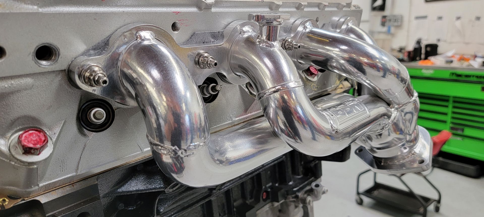A close up of a exhaust pipe on a car enginev