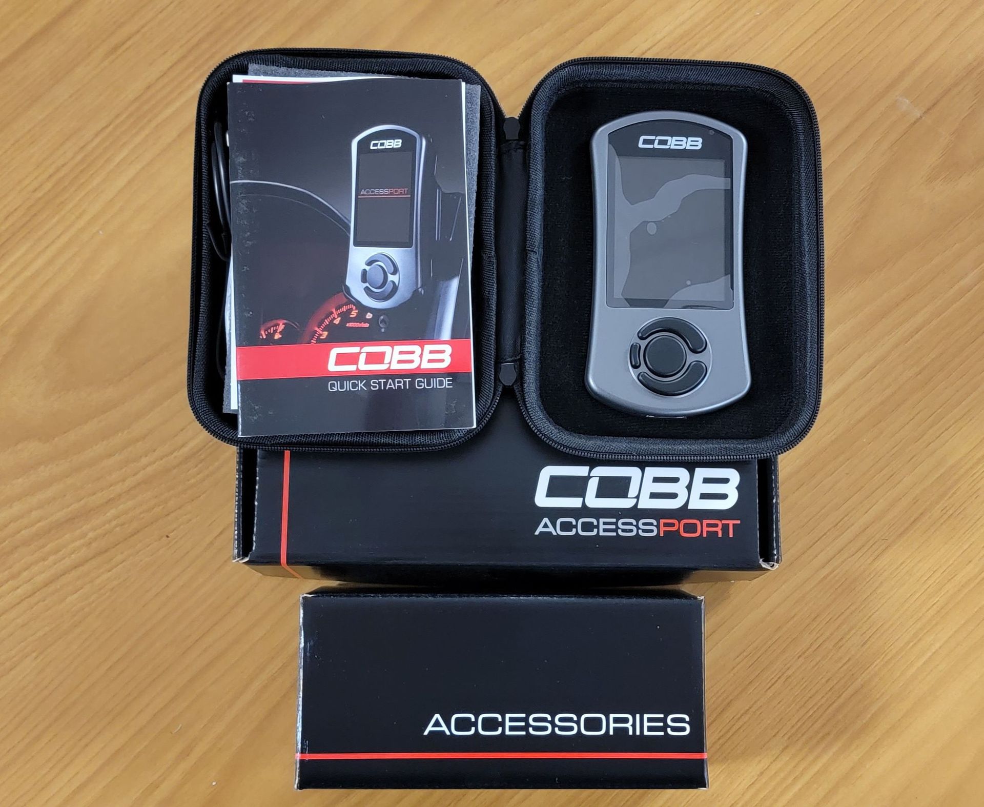 A cobb accessory is sitting on a wooden table | Griffin Motorwerke