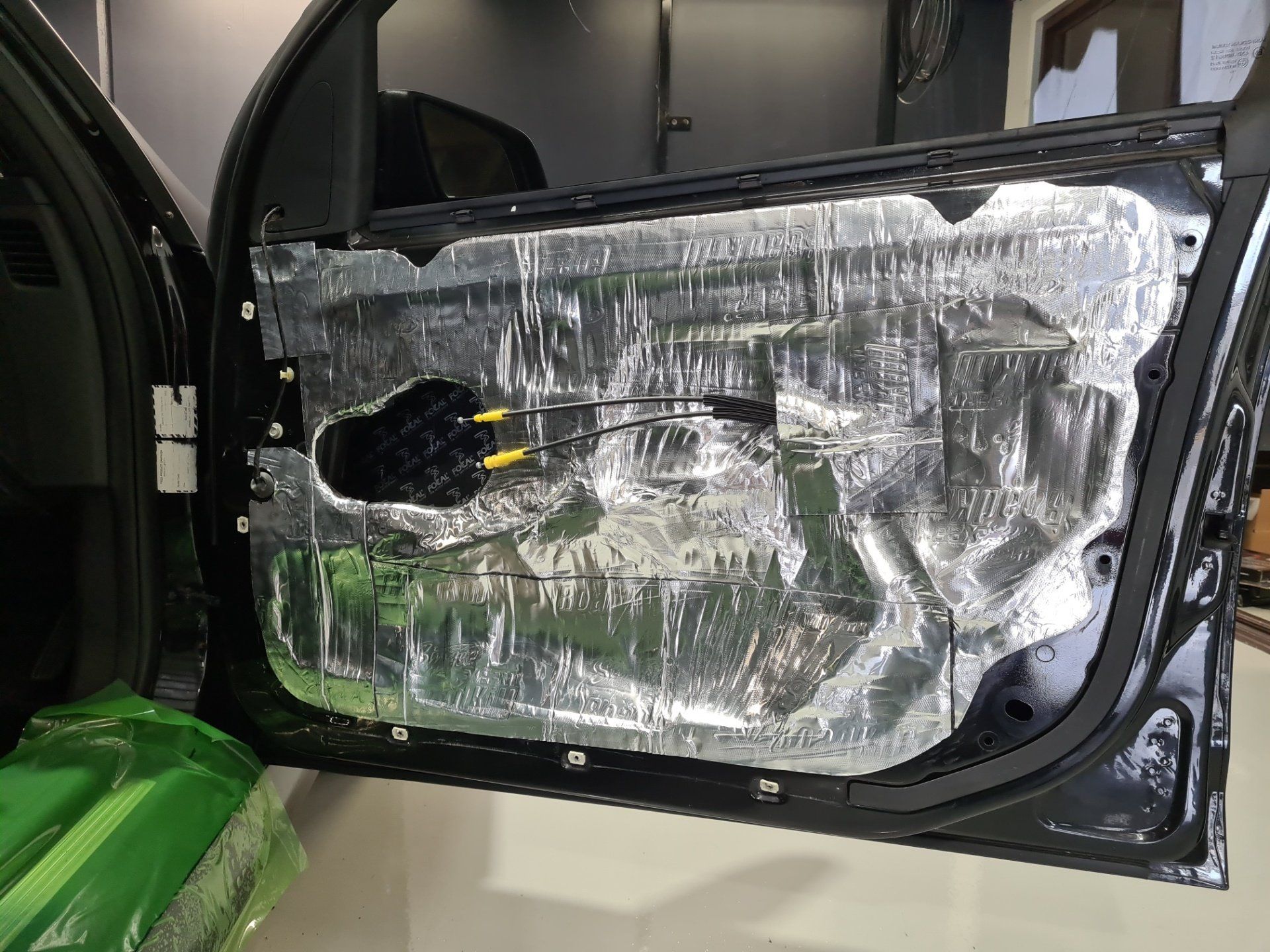 Sound Deadening Being Installed In Car Door— Car Speakers Gold Coast in Gold Coast, QLD
