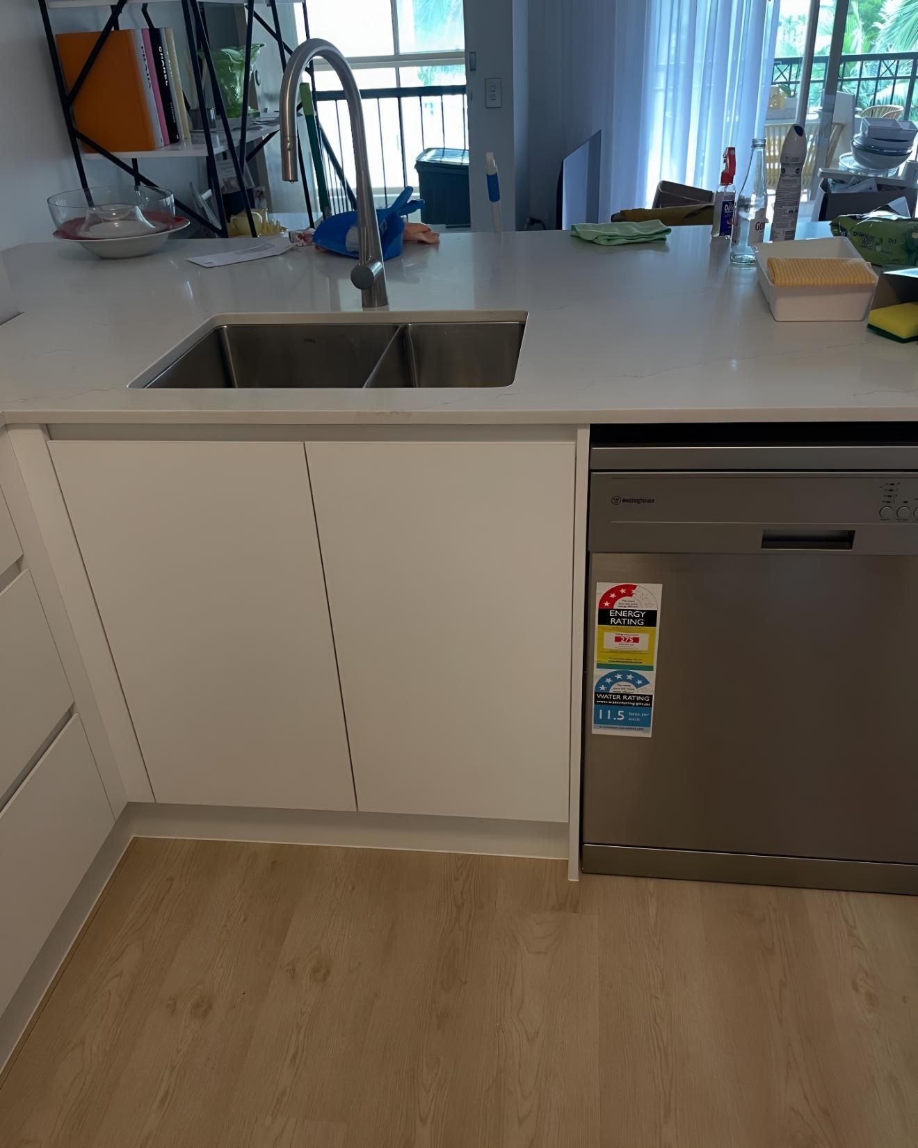 Kitchen With a Stainless Steel Dishwasher and a Sink — Luke Barry Plumbing in Coomera, QLD