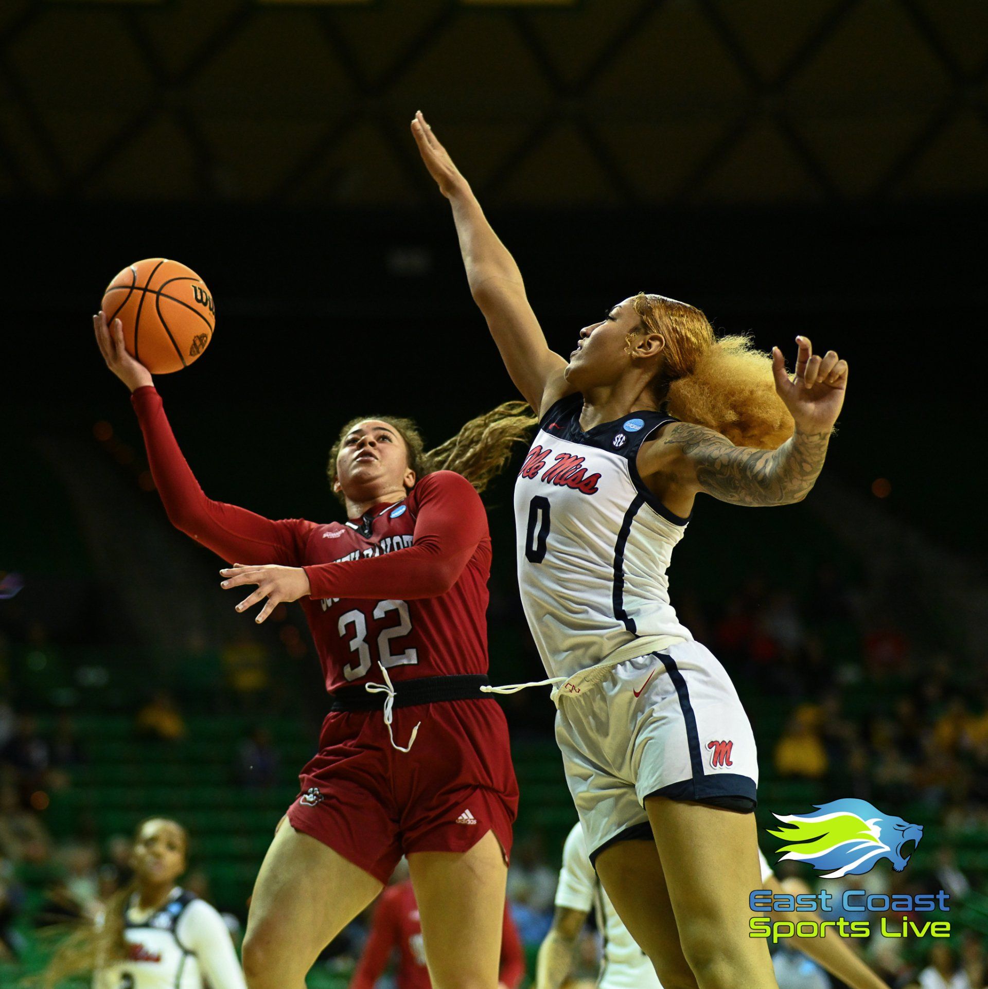 A female basketball player with the number 32 on her jersey