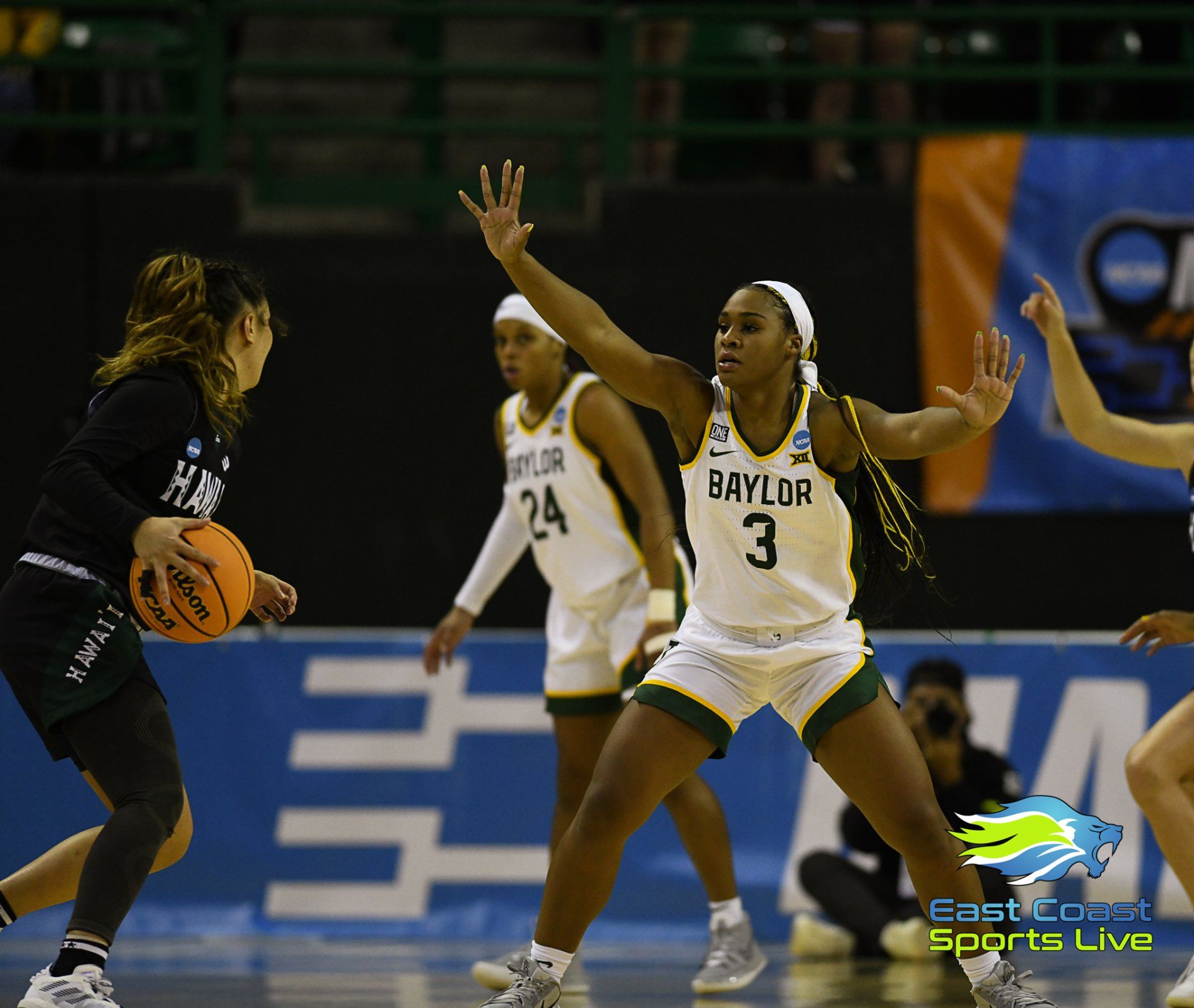 A female basketball player with the number 3 on her jersey