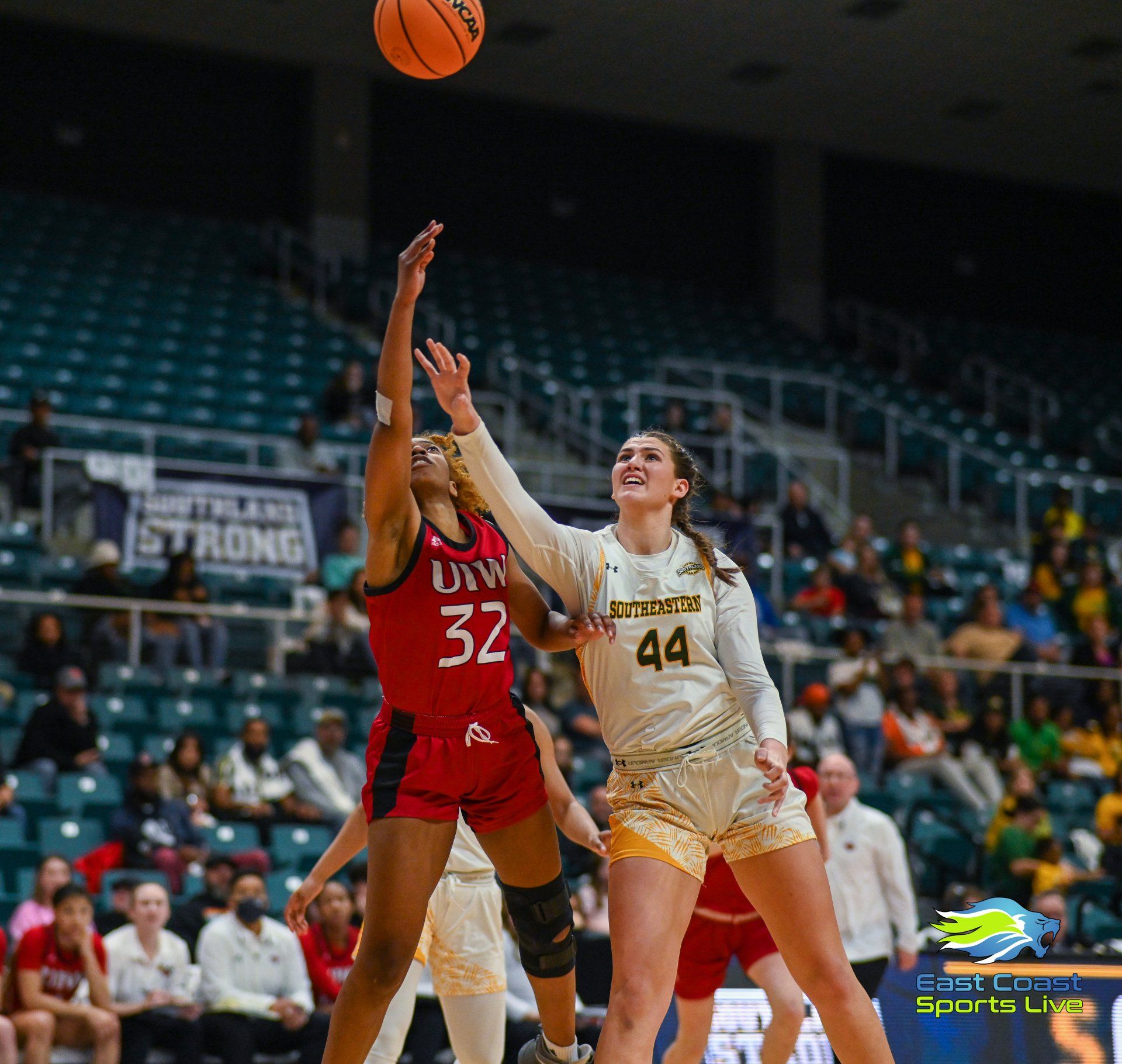 A female basketball player with the number 32 on her jersey