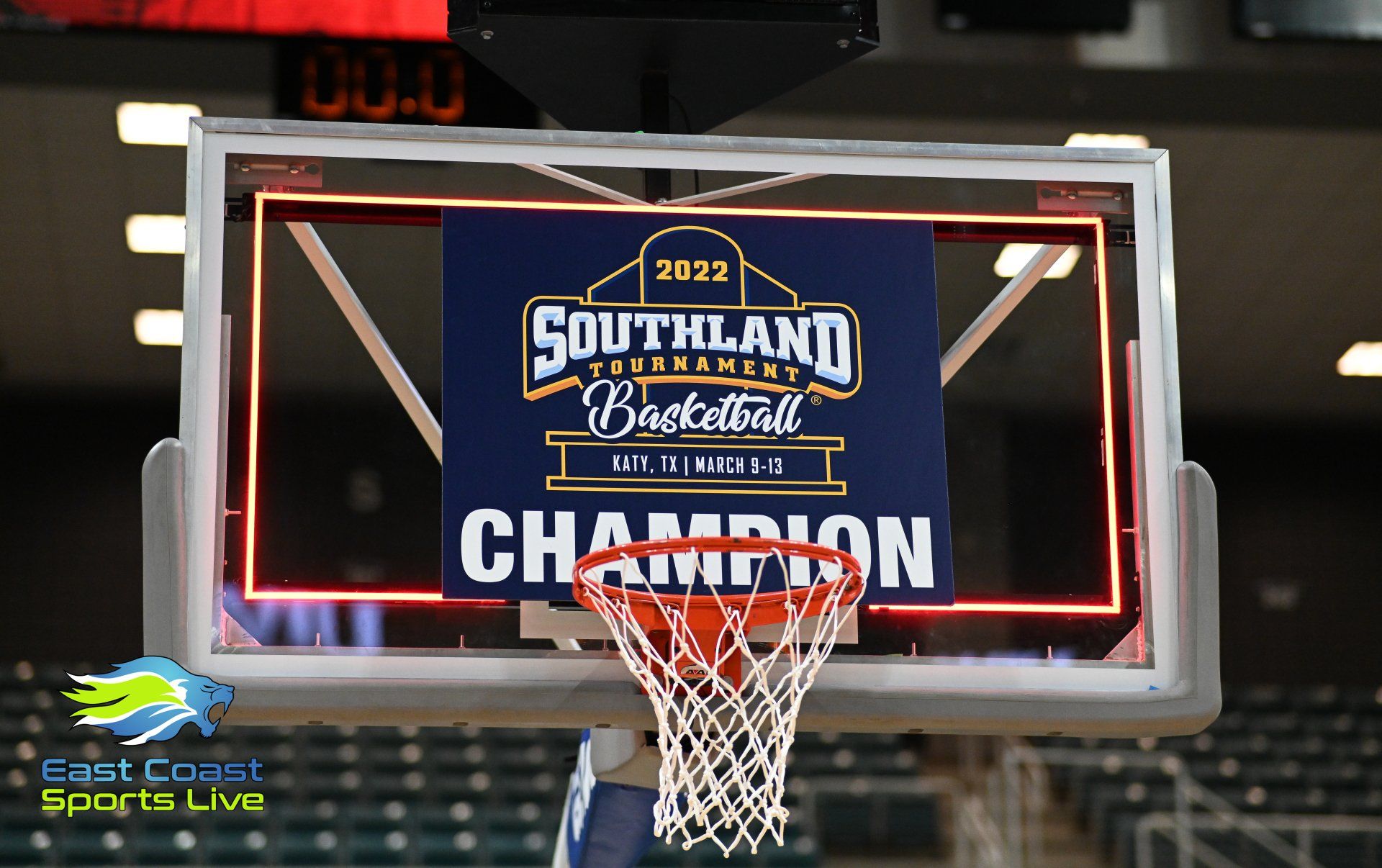 A basketball hoop with a sign that says southland tournament champion