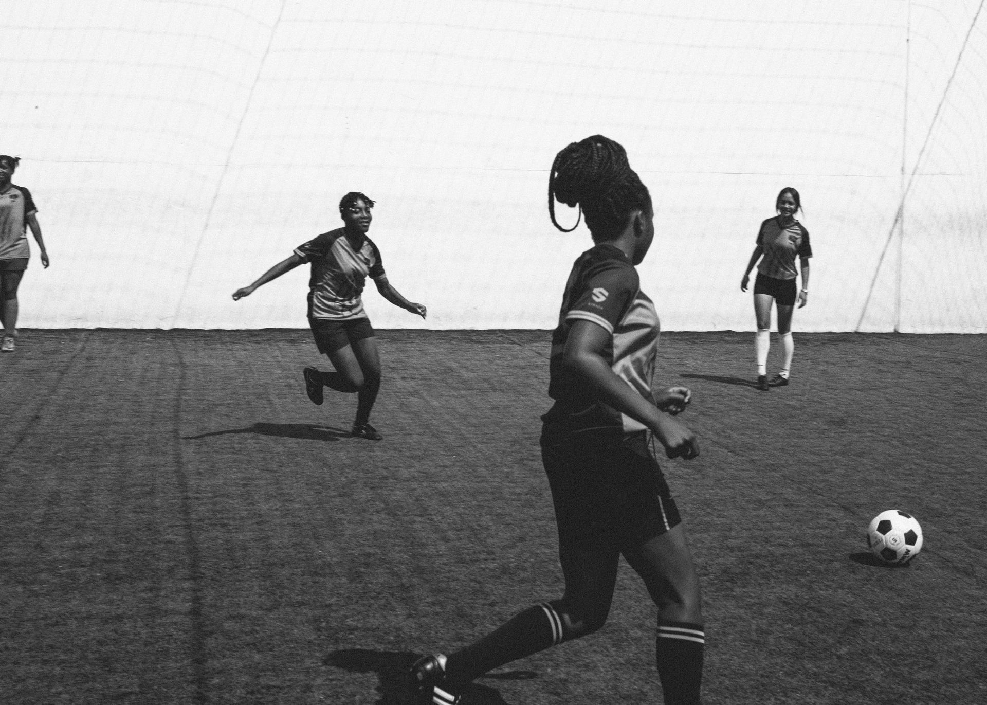 A goup of young athletes playing soccer