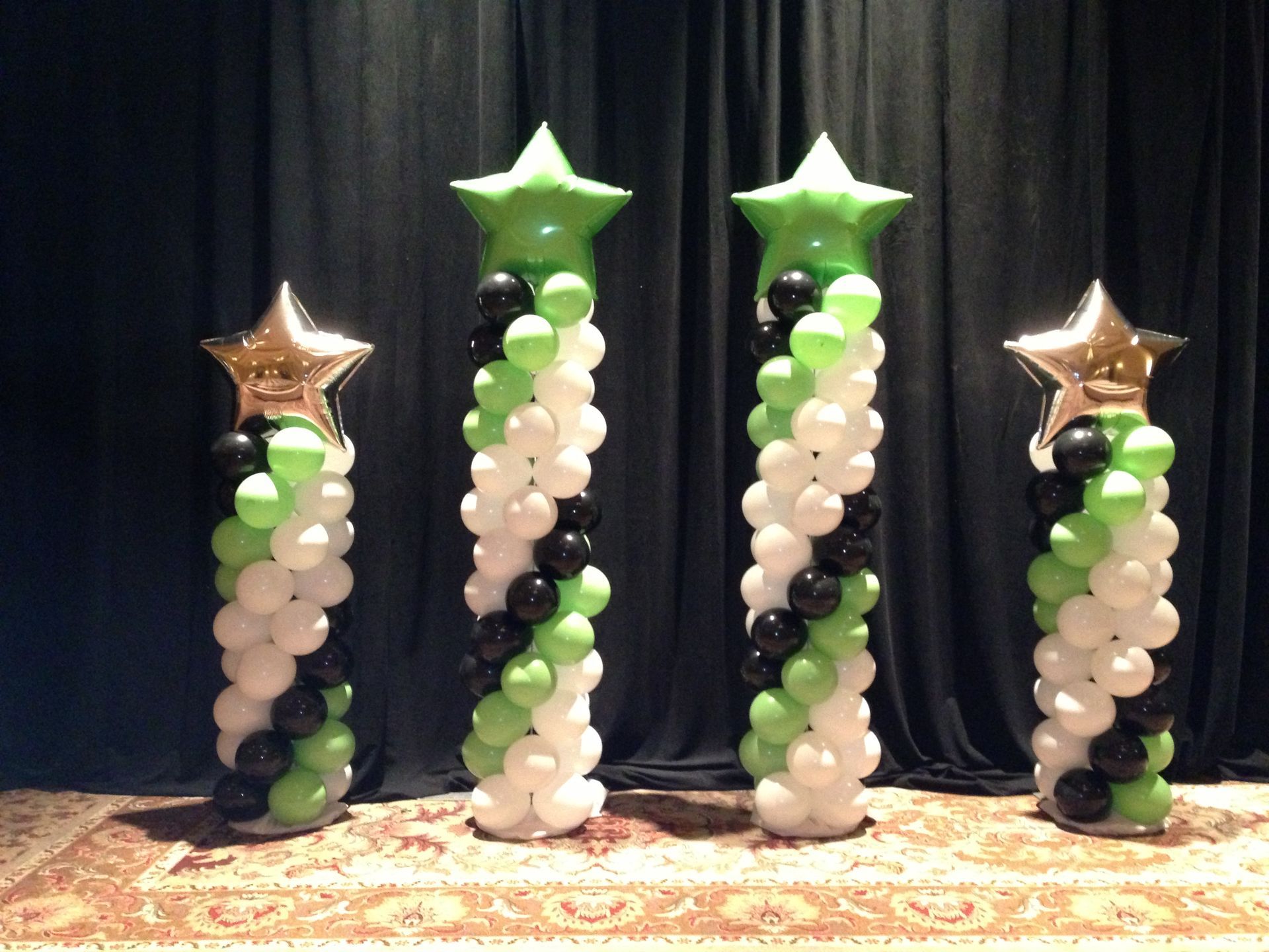 A room with chairs and balloons that say inspire