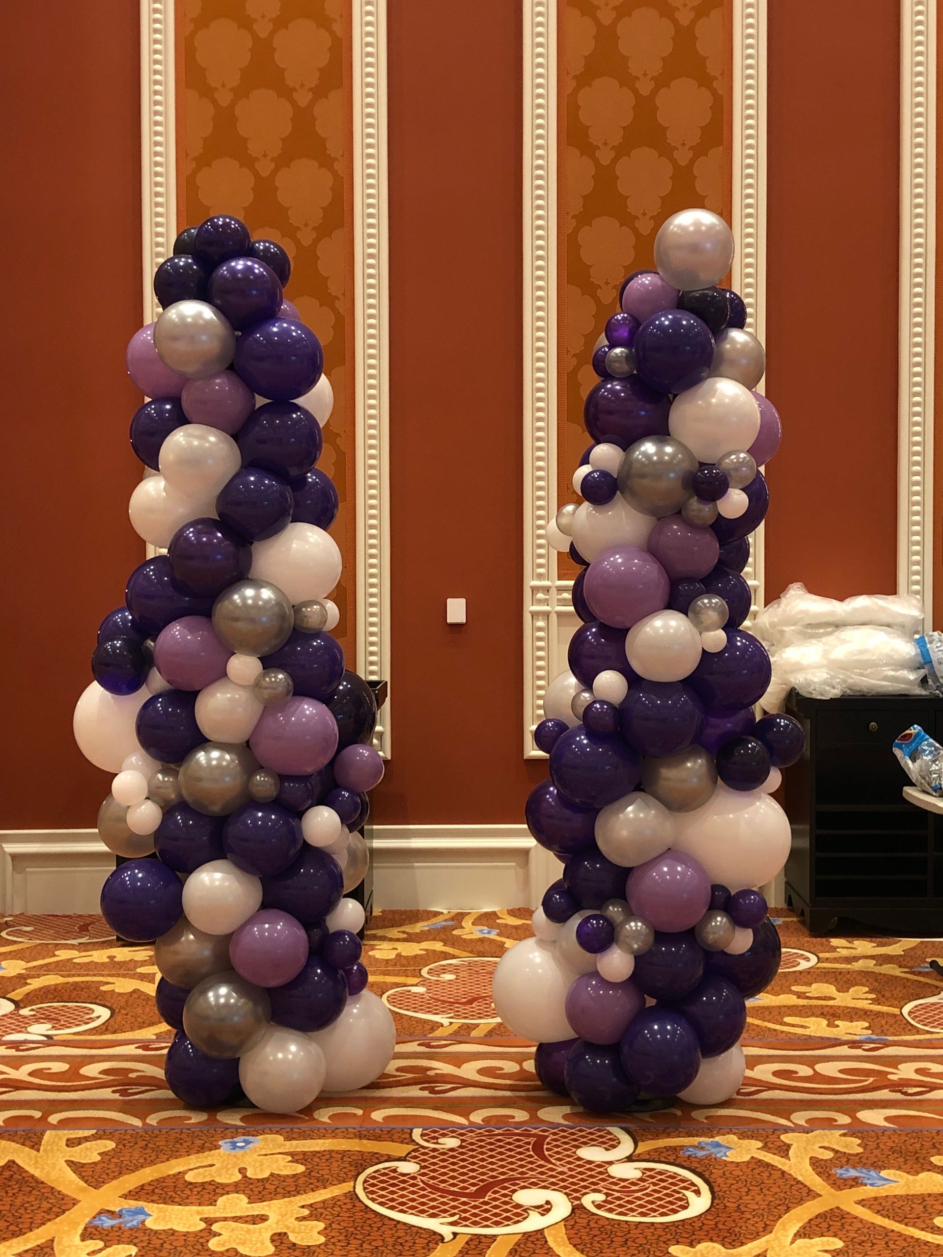 A bunch of white balloons are stacked on top of each other